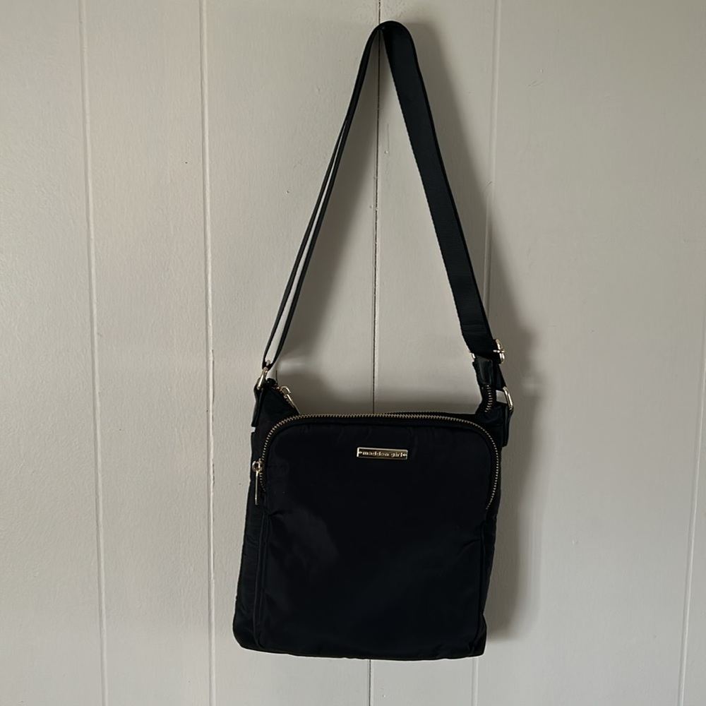 MADDEN GIRL Black Crossbody with Gold Accents. On trend and super convenient.